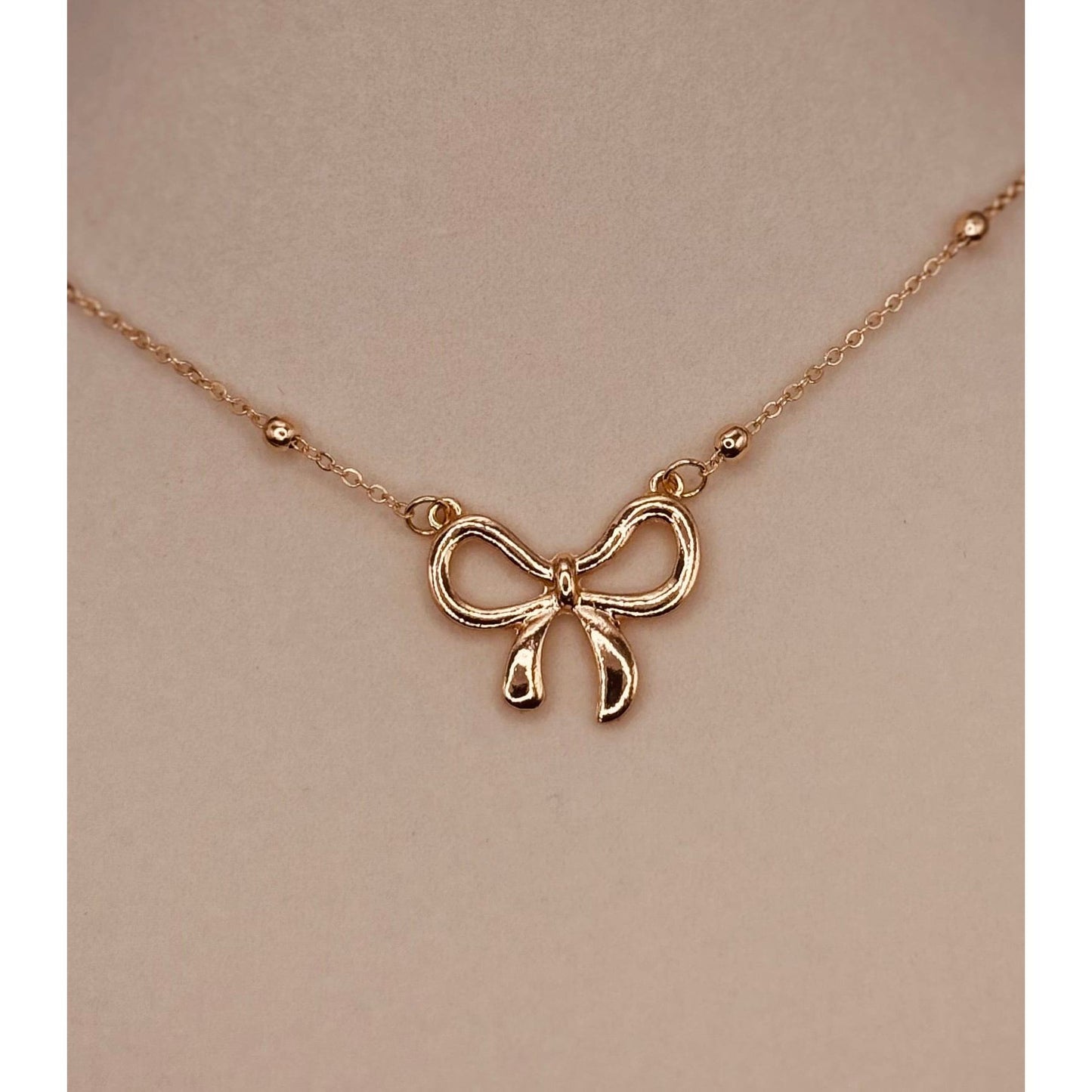 The Smiley Face Boutique Golden Bow Necklace 🎀